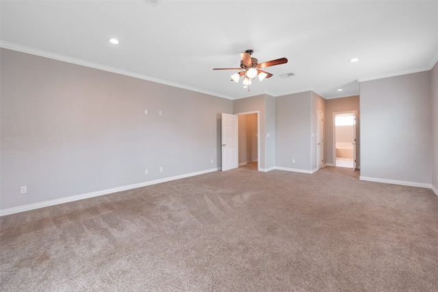 carpeted spare room featuring ceiling fan and ornamental molding