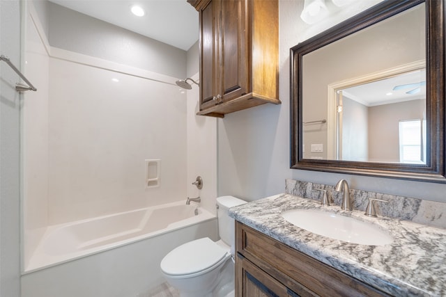 full bathroom with shower / tub combination, vanity, and toilet