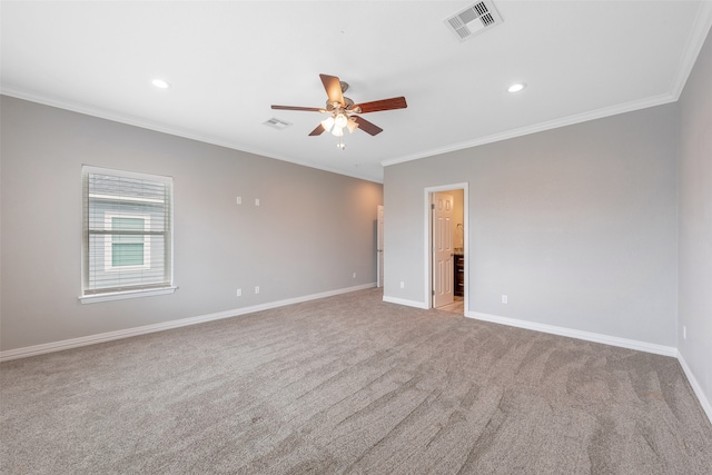 unfurnished room with light colored carpet, ceiling fan, and crown molding