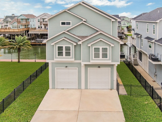 view of front of property with a front yard, a garage, a water view, and central AC unit