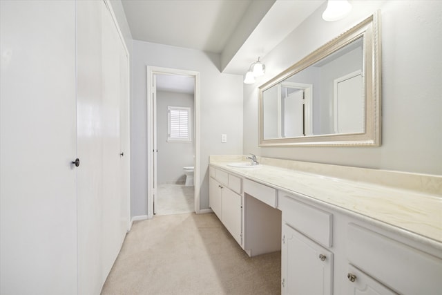 bathroom featuring toilet and vanity