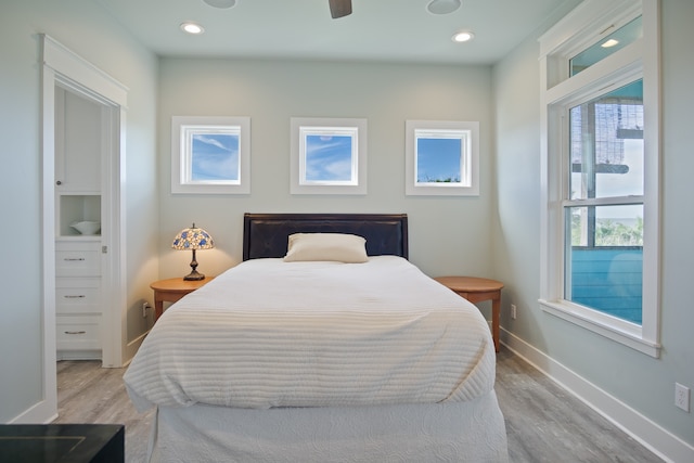 bedroom featuring ceiling fan and light hardwood / wood-style flooring