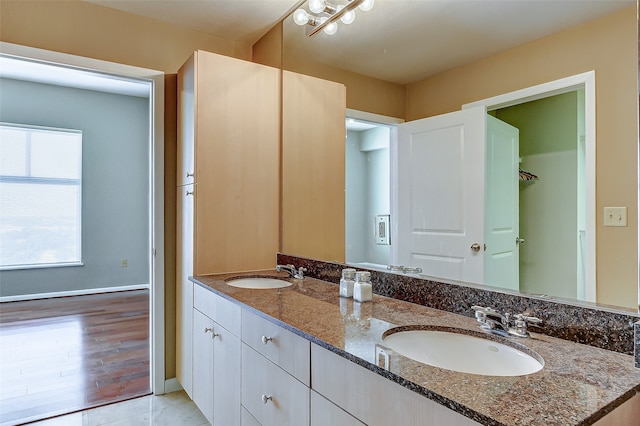 bathroom with wood-type flooring and vanity