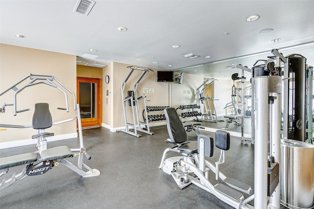 exercise room with a textured ceiling