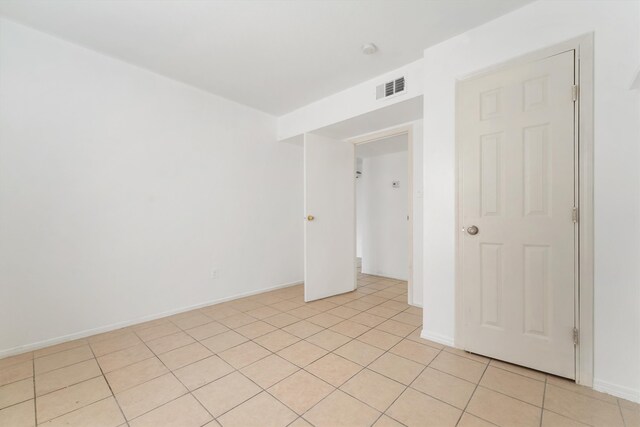 interior space featuring light tile floors