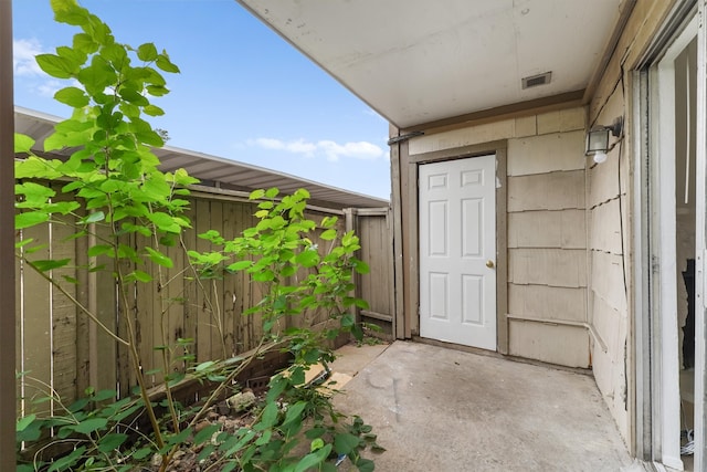 entrance to property featuring a patio