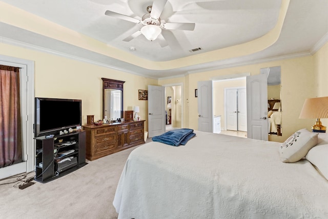 carpeted bedroom featuring a raised ceiling, ornamental molding, and ceiling fan