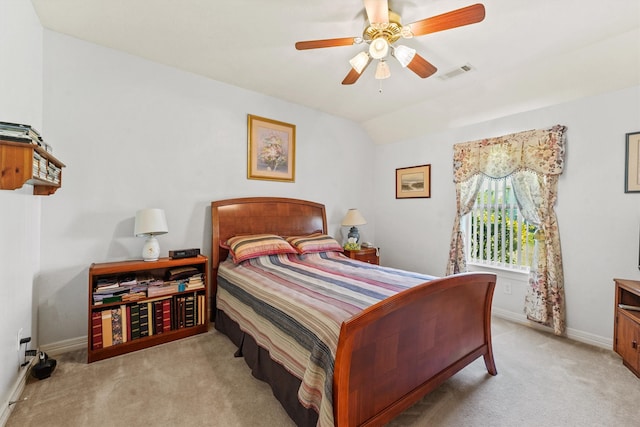 bedroom featuring light colored carpet and ceiling fan