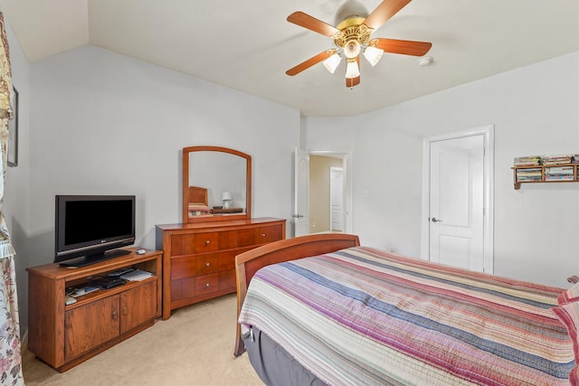 carpeted bedroom featuring ceiling fan and lofted ceiling