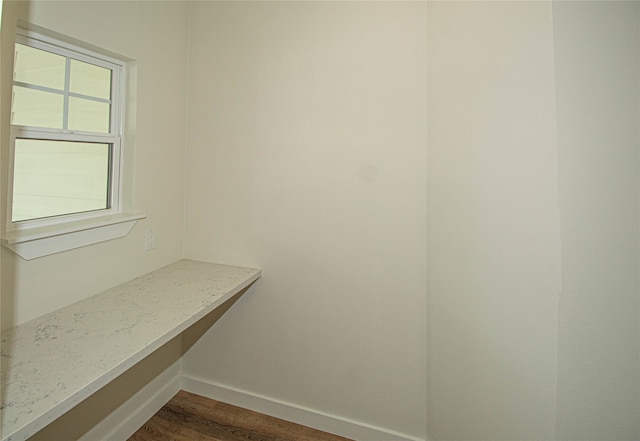 interior space with a healthy amount of sunlight and hardwood / wood-style floors