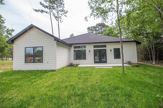 rear view of property with a yard and french doors