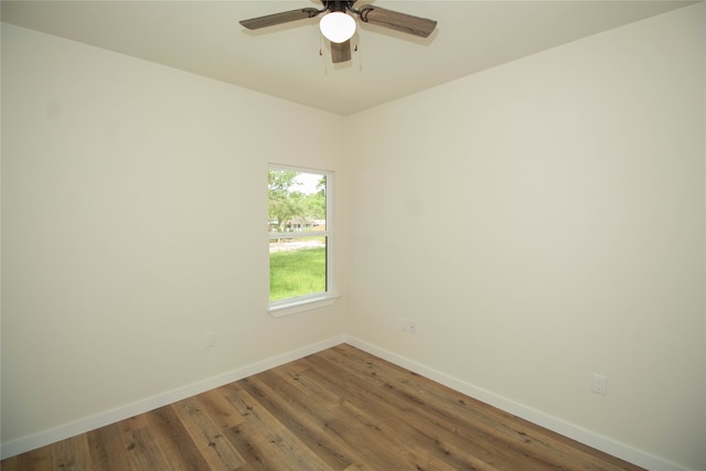 unfurnished room featuring dark hardwood / wood-style floors and ceiling fan