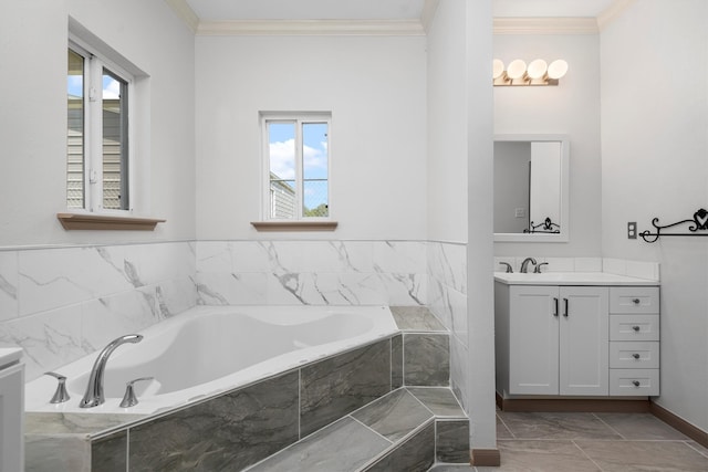 bathroom with tiled tub, ornamental molding, tile floors, and vanity with extensive cabinet space