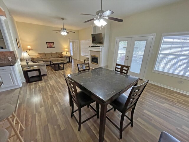 dining room featuring french doors, light hardwood / wood-style floors, and ceiling fan