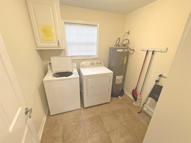 laundry room featuring electric water heater, washing machine and dryer, and light tile floors