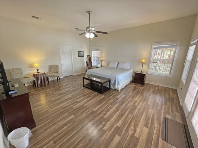 bedroom with ceiling fan and dark wood-type flooring