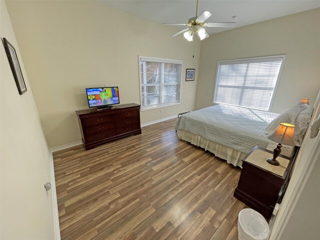 bedroom featuring ceiling fan and dark hardwood / wood-style flooring