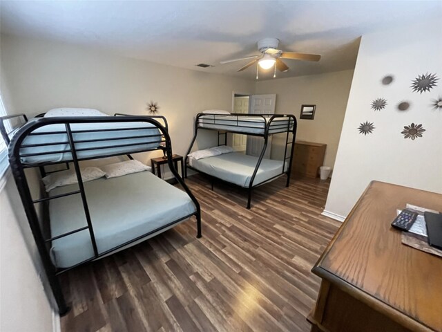 bedroom featuring ceiling fan and dark wood-type flooring