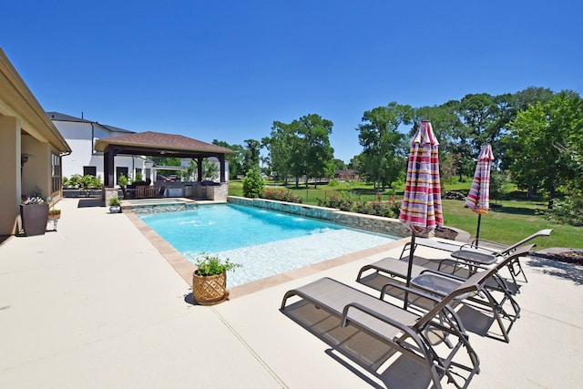 view of swimming pool with a patio and a gazebo