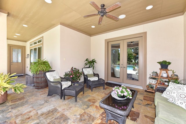 view of patio with french doors and ceiling fan