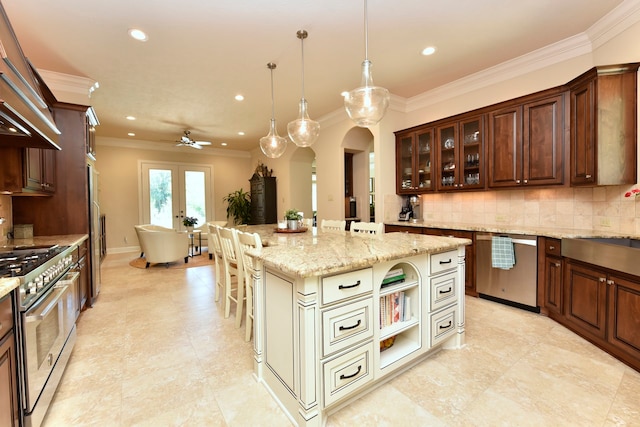 kitchen featuring hanging light fixtures, ornamental molding, backsplash, stainless steel appliances, and a kitchen island