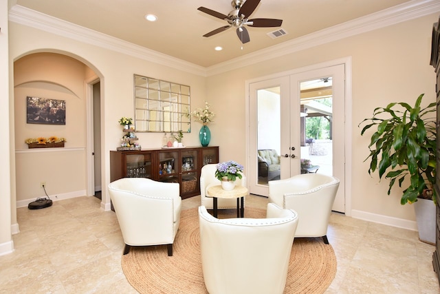 sitting room featuring french doors, ceiling fan, crown molding, and light tile flooring