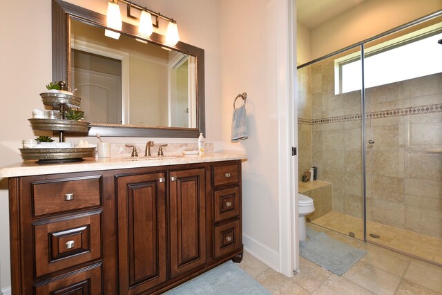 bathroom with walk in shower, toilet, tile floors, and vanity