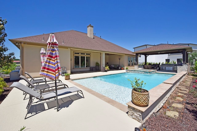 view of swimming pool featuring a patio and a gazebo