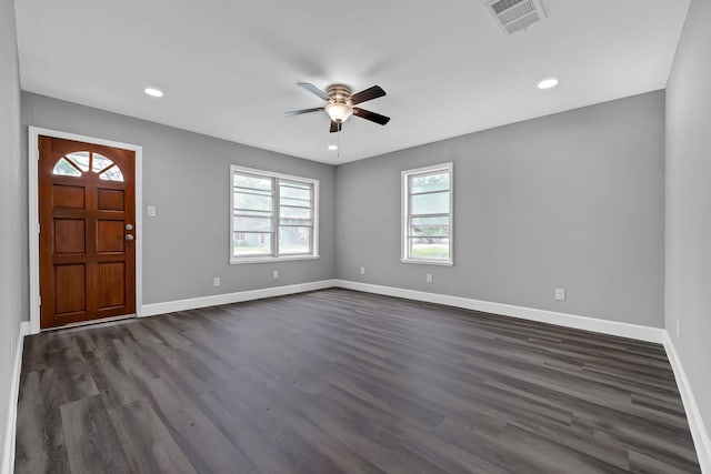 foyer entrance with ceiling fan and dark hardwood / wood-style floors