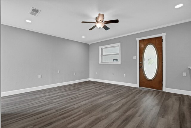 foyer featuring dark hardwood / wood-style floors, ornamental molding, and ceiling fan