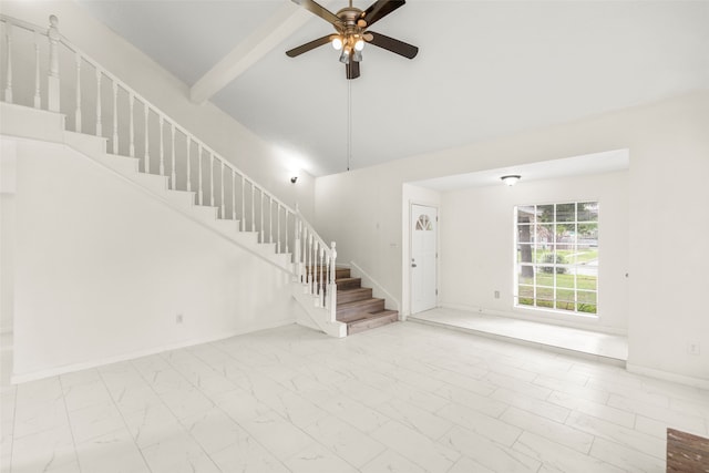 tiled empty room featuring ceiling fan and a towering ceiling