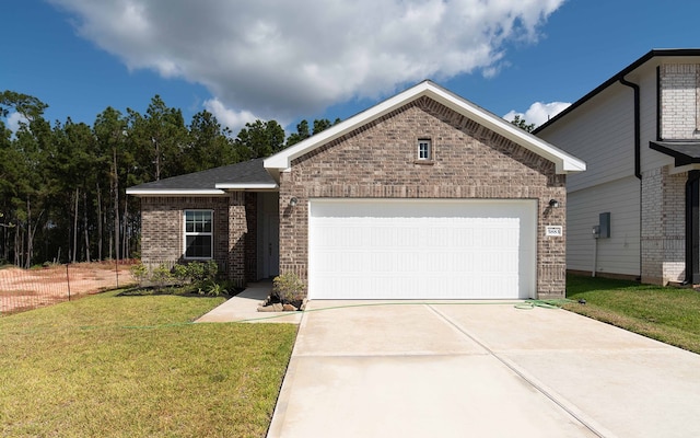 ranch-style home featuring a garage and a front yard