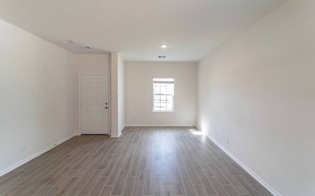 spare room with hardwood / wood-style floors