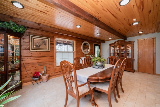 dining space with beamed ceiling, wood ceiling, and light tile floors