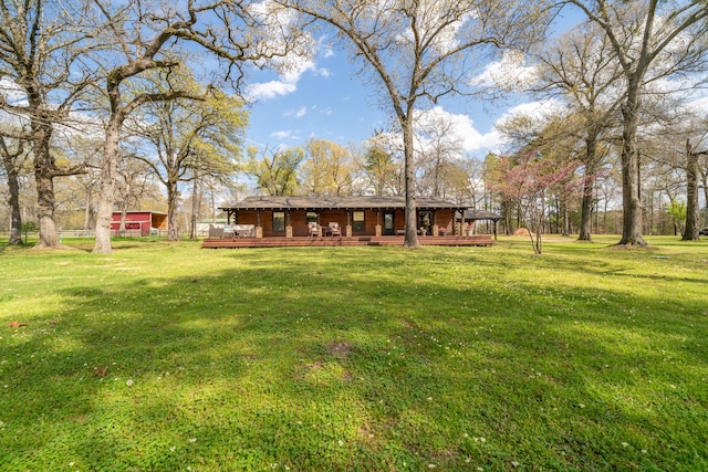 view of yard featuring a wooden deck