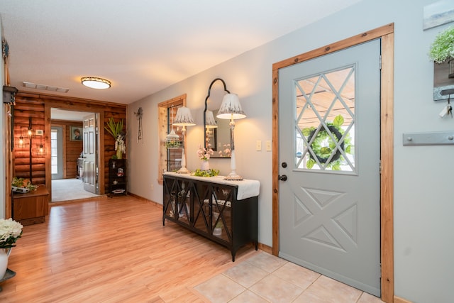 doorway featuring light tile floors