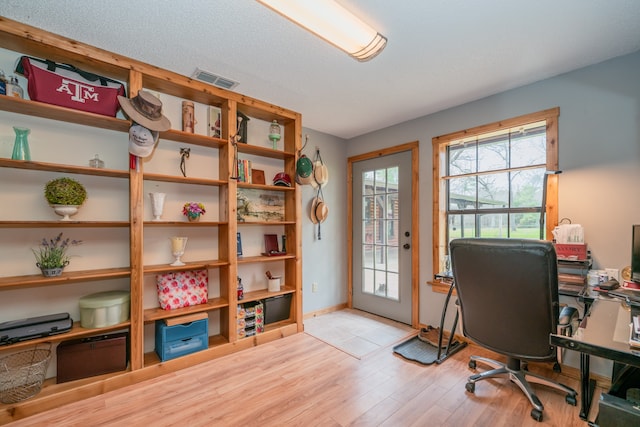 office space with light hardwood / wood-style floors