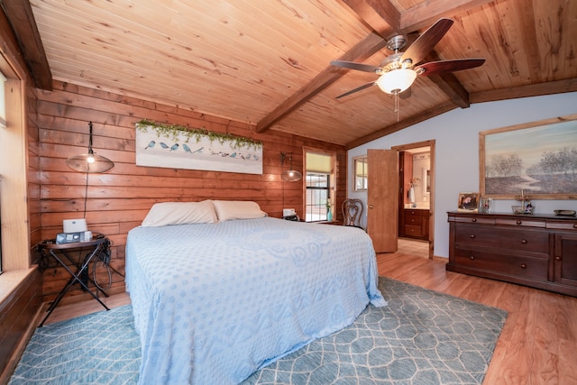 bedroom featuring ceiling fan, ensuite bath, wood ceiling, light hardwood / wood-style flooring, and lofted ceiling with beams