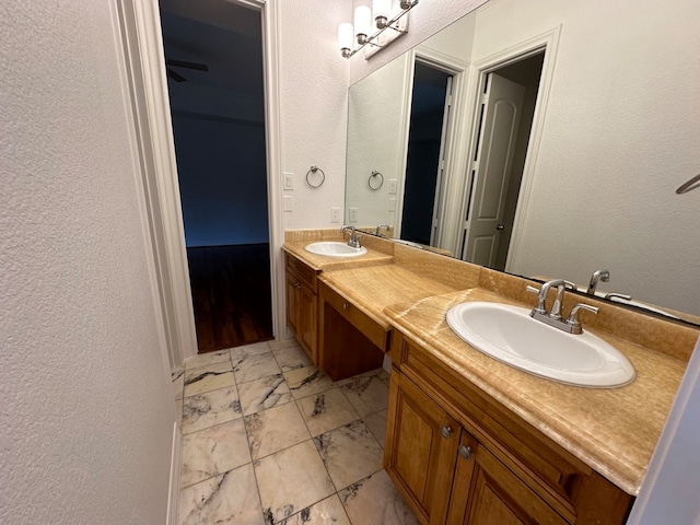 bathroom featuring tile flooring and dual vanity