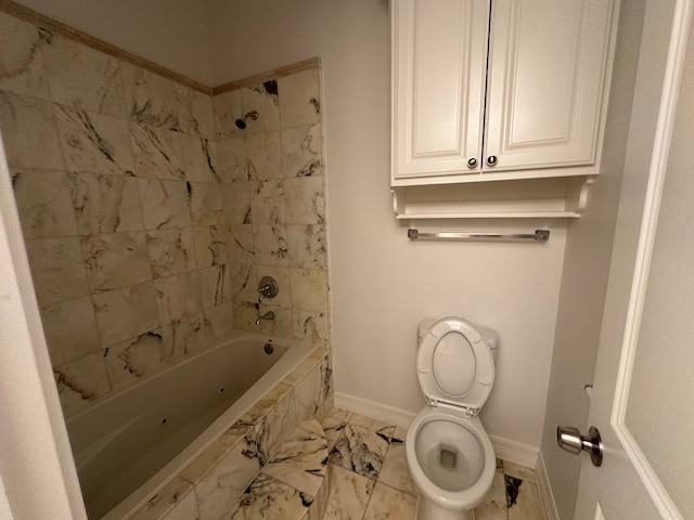 bathroom with toilet, tile floors, and tiled shower / bath combo