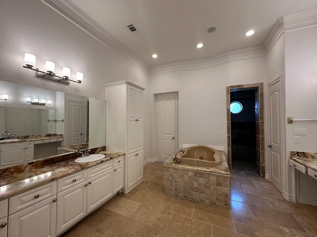 bathroom featuring tiled bath, tile floors, vanity, and crown molding