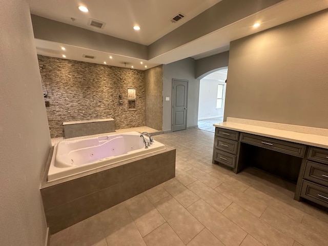 bathroom with vanity and tile flooring