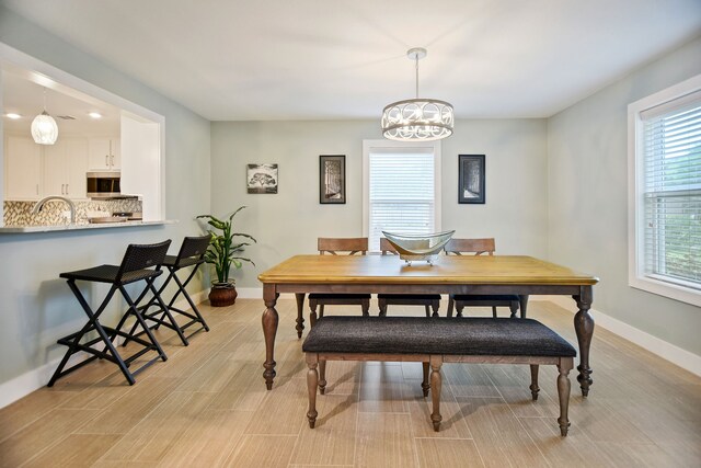 dining space with a chandelier