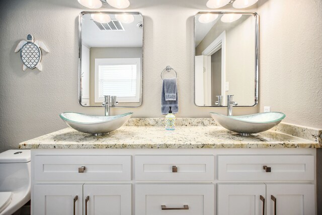 bathroom featuring double sink vanity