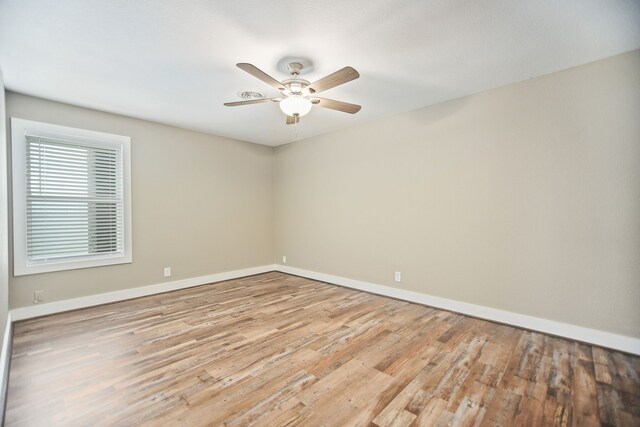 unfurnished room with light hardwood / wood-style floors and ceiling fan