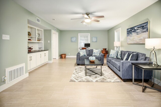 living room with ceiling fan