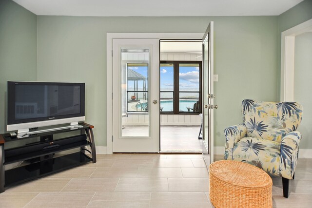 doorway to outside with light tile floors