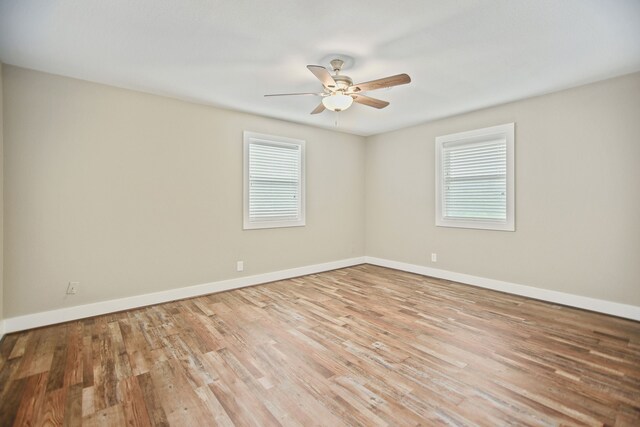 unfurnished room featuring ceiling fan and light hardwood / wood-style flooring