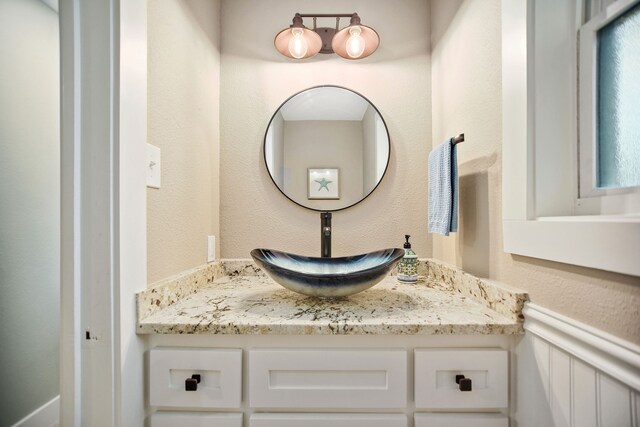 bathroom featuring plenty of natural light and vanity