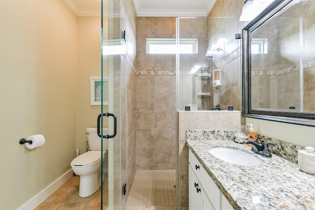 bathroom featuring tile patterned flooring, vanity, toilet, a shower with shower door, and crown molding